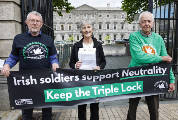 Catherine Connolly (Centre) pictured outside Dáil Eireann with former peacekeepers. She is holding a letter calling on the government to save the Triple Lock.
